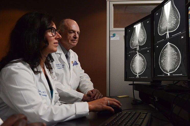 cancer physicians looking at mammography scan