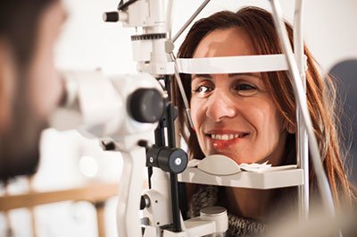 Woman over 40 getting eye exam 
