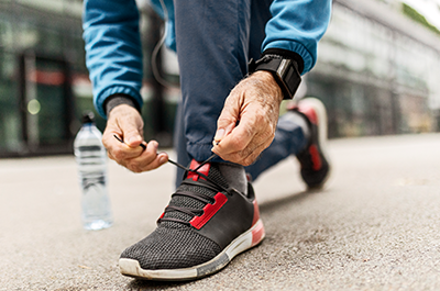 man tying shoes