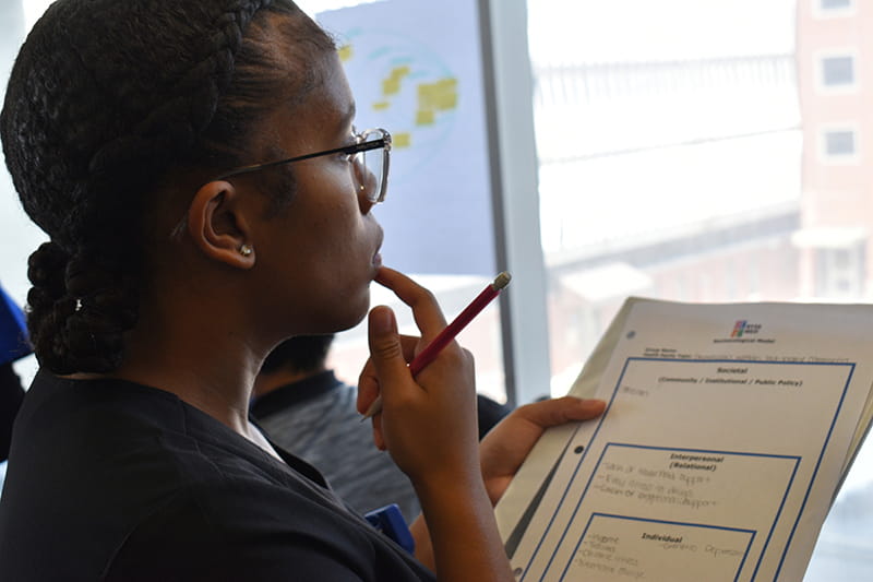 student taking notes in classroom