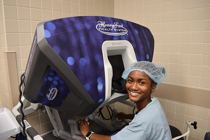 RYSE MED student seated at machine in clinic